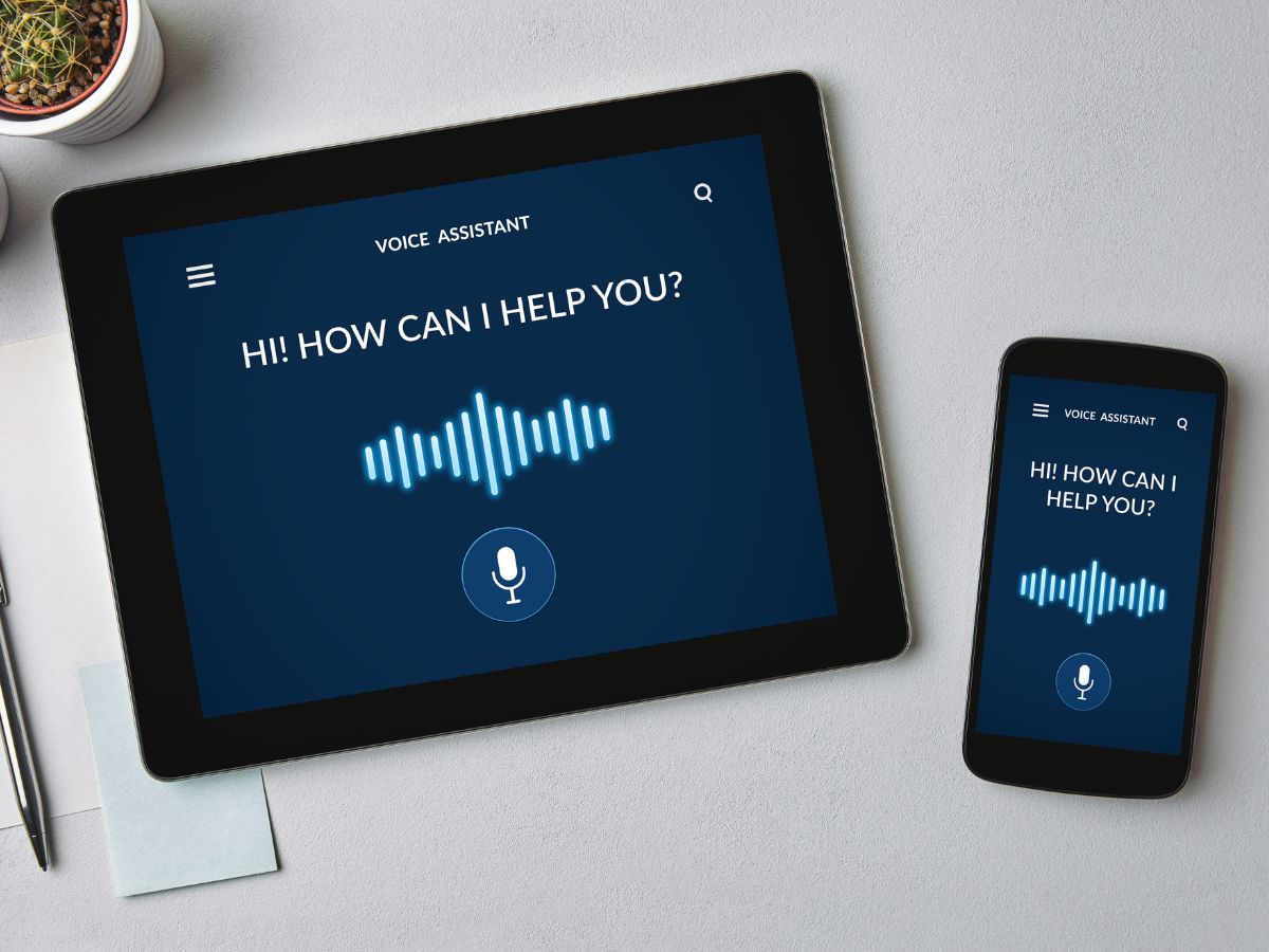 Tablet and phone displaying a voice assistant interface.