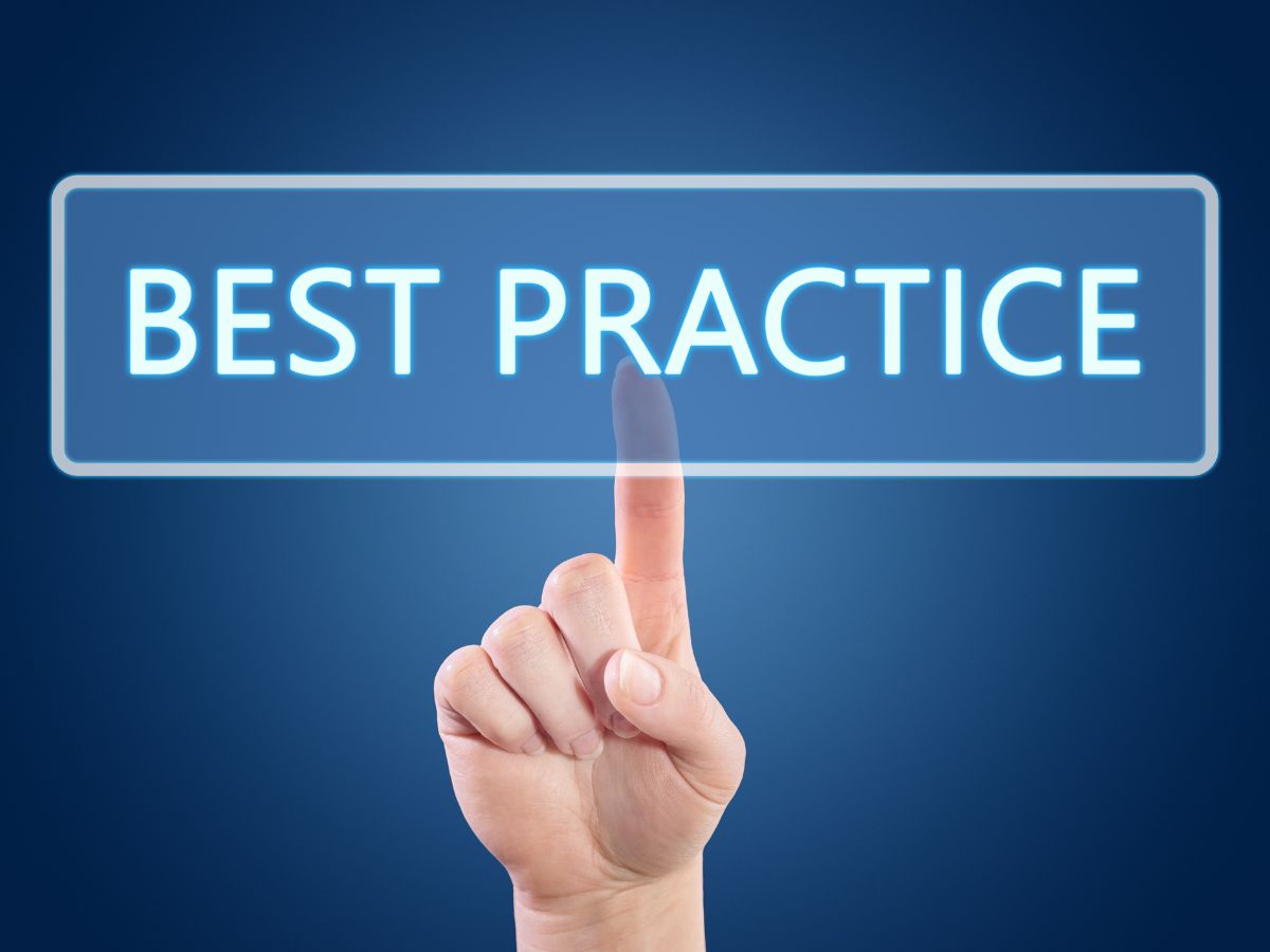 Finger touching a glowing "Best Practice" button.